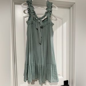 Large light blue / teal dress with bow detail on back